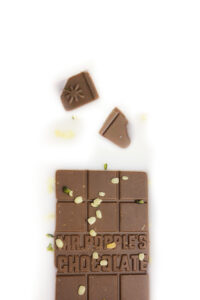 Vegan Chocolate in milk with hemp seeds and chocolate squares
