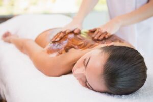 Woman receiving a chocolate back massage