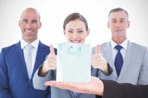 businessman holding hand out with corporate gift free from allergens