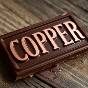 Closeup of a dark chocolate bar with copper lettering