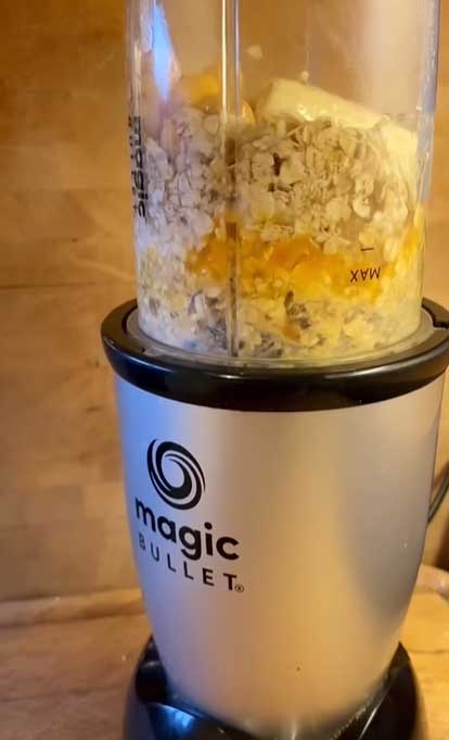 cookie dough baked oat mug cake ready to blend in a blender