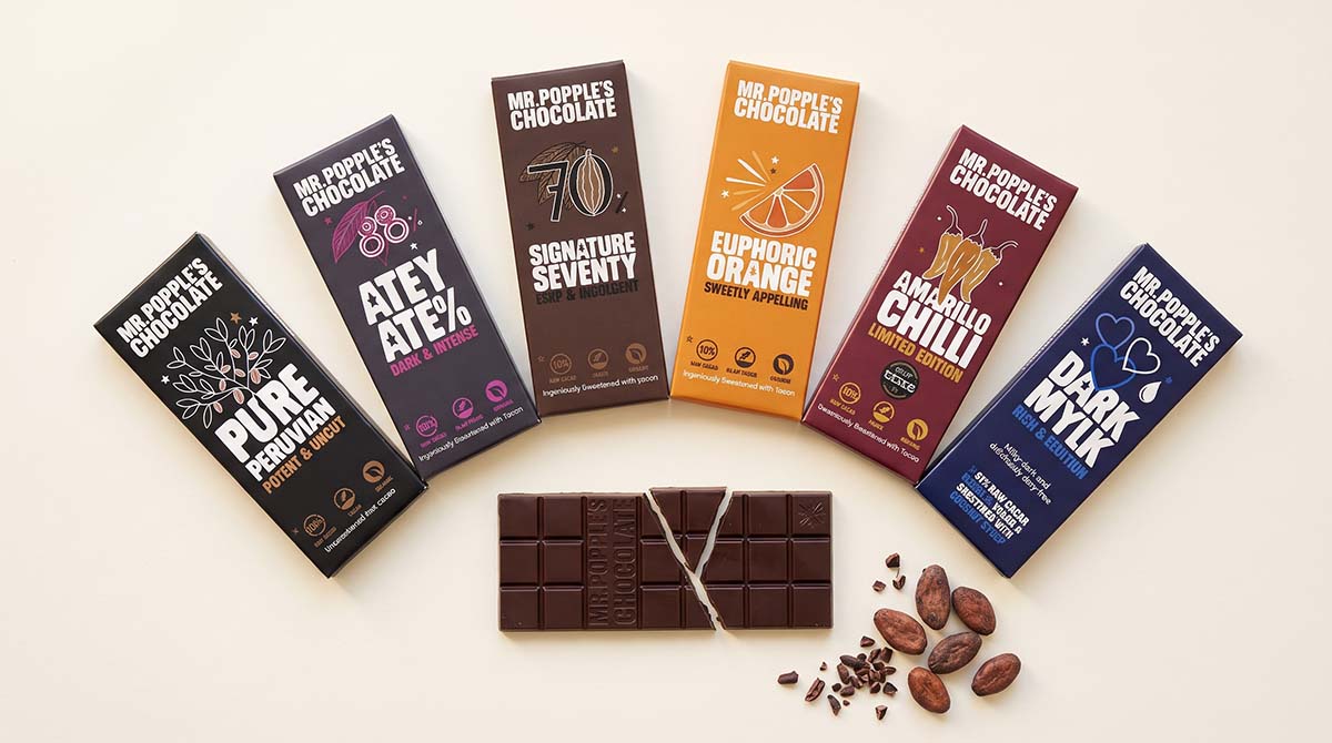 Mr Popple's Chocolate dark bars in their wrappers: Pure Peruvian, Atey Ate%, Signature Seventy, Euphoric Orange, Amarillo Chilli and Dark Mylk