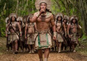 an ancient mayan warrior pauses to drink a cup of cacao